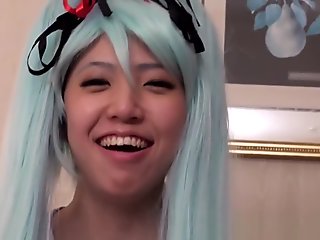 Japanese bluehaired cosplay babe enjoys sucking black cock